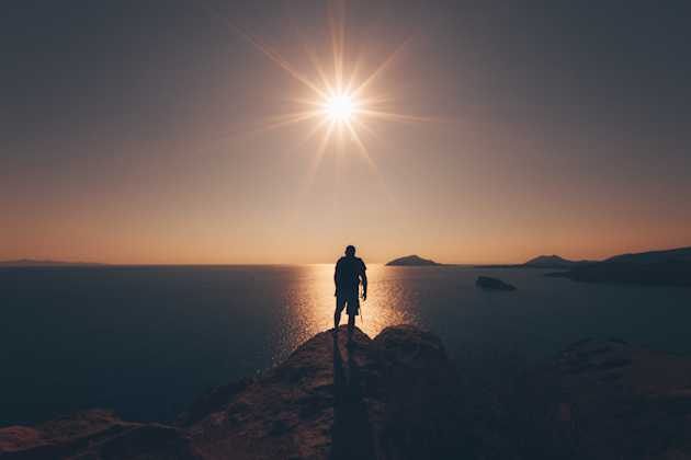 man looking into an ocean’s horizon