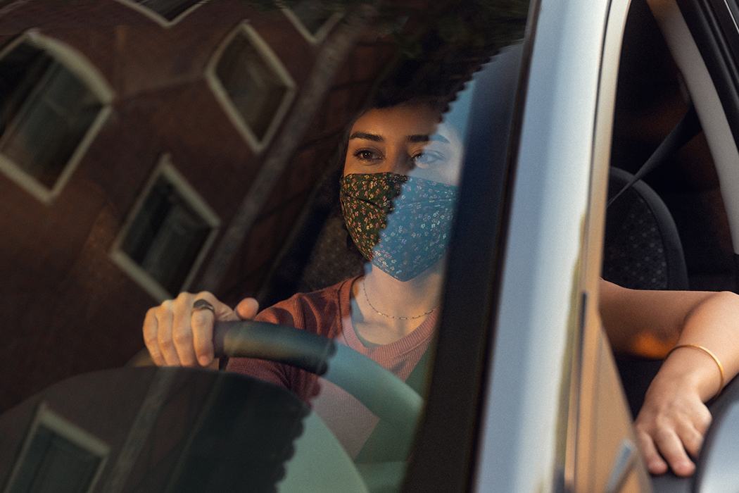 Woman sitting in drivers seat of car