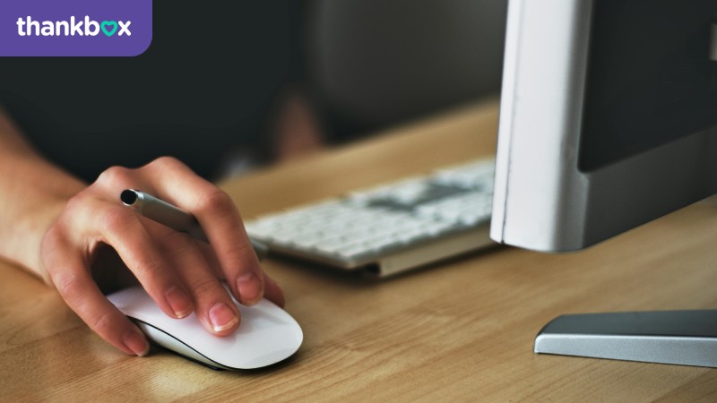 Person Holding Apple Magic Mouse