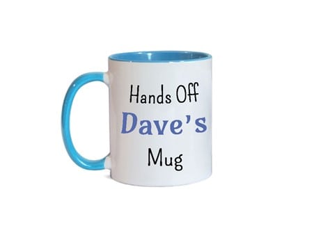 A white mug with 'Hands off Dave's mug' writing on it