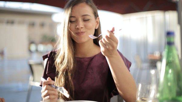 Young woman enjoying her meal