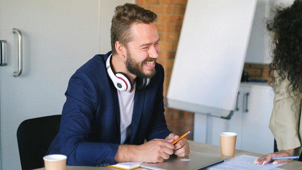 Happy man working in office