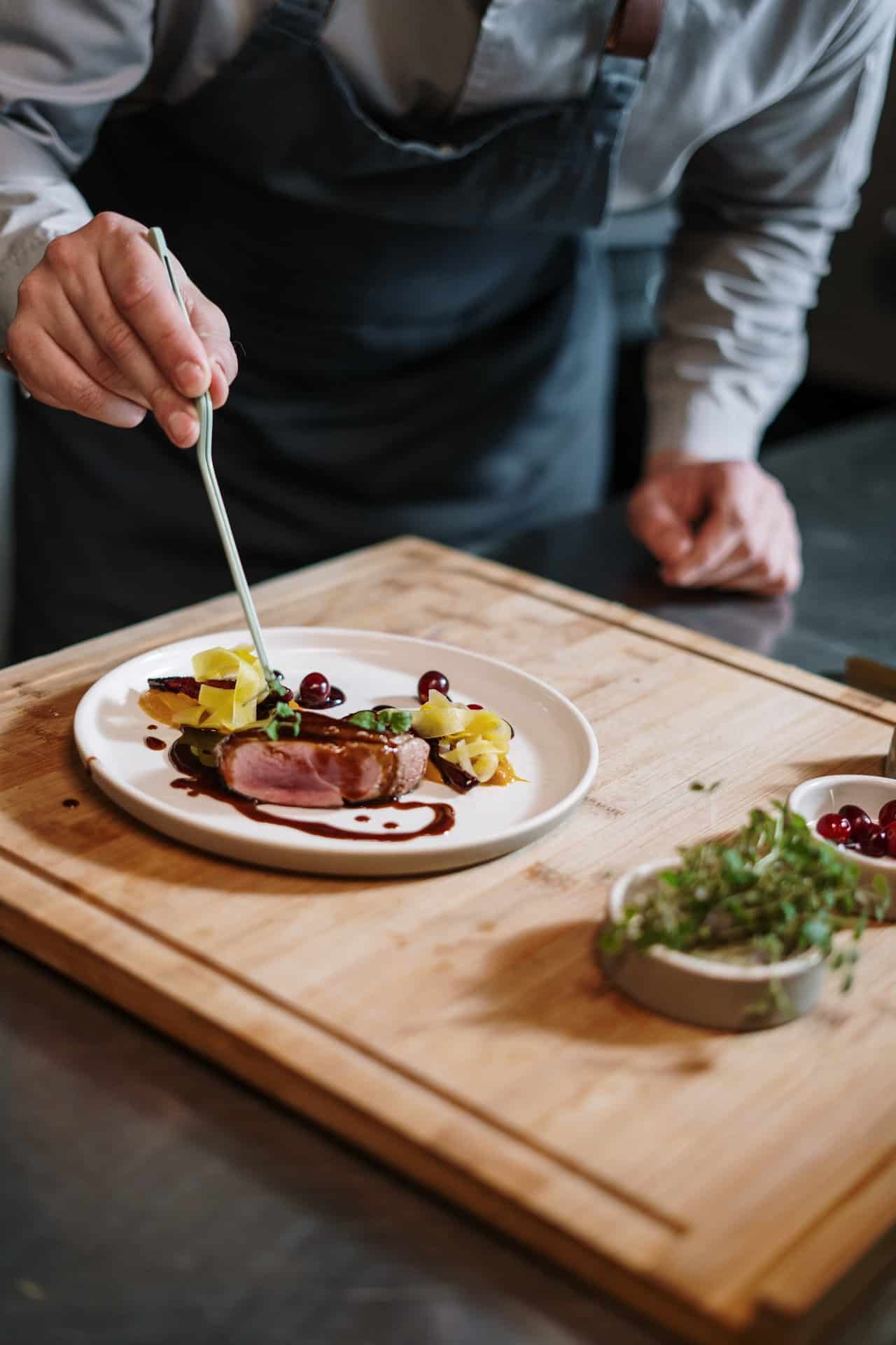 An image of a cooking experience and plating up a dish