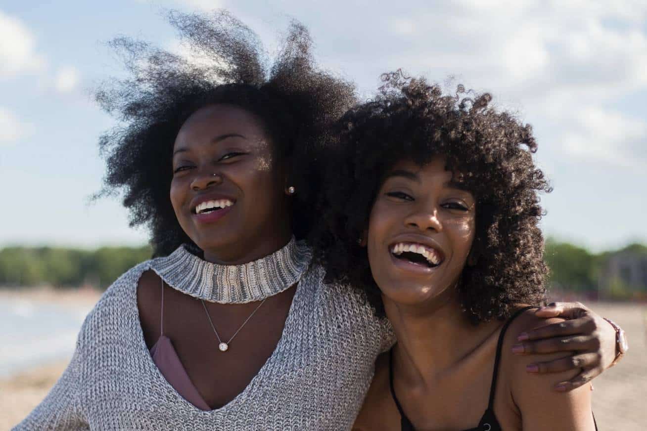 Two happy, smiling women.