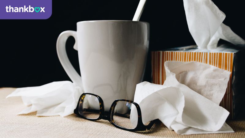 Tissues, mug of tea and glasses for being sick
