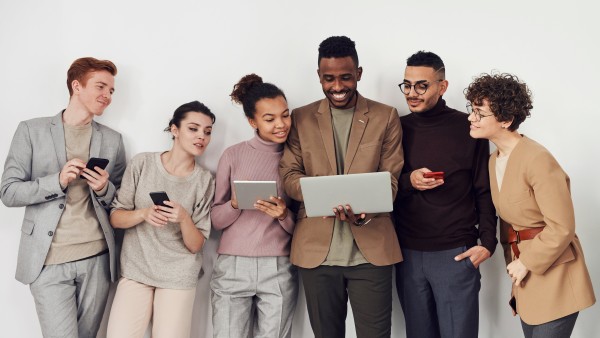 Coworkers looking at a laptop screen