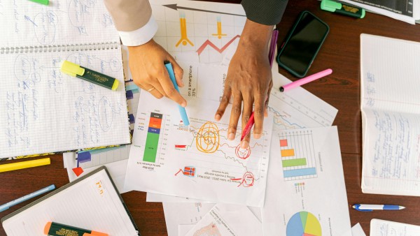 Top shot of a desk covered with papers