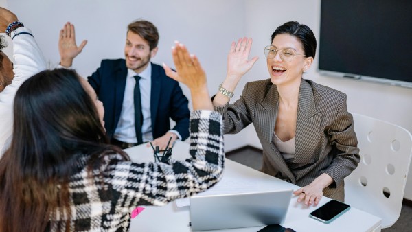 Happy employees doing high-five