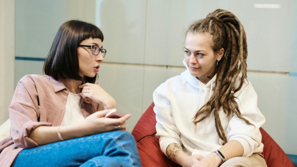 Two women talking while sitting