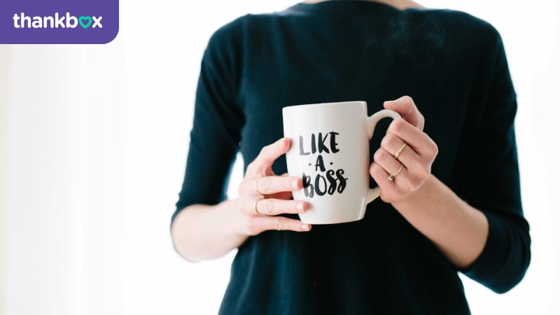 Woman holding a white mug