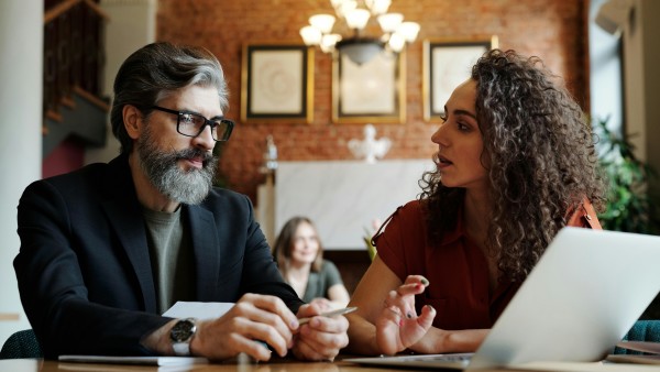 Man and a woman having a serious conversation in a café