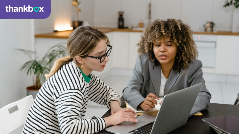 Women working together on a laptop