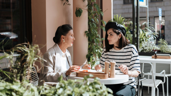 Two women eating together in a cafe