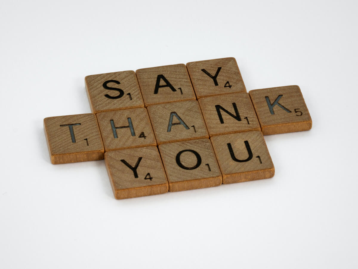 Say Thank You written in wood Scrabble type tiles