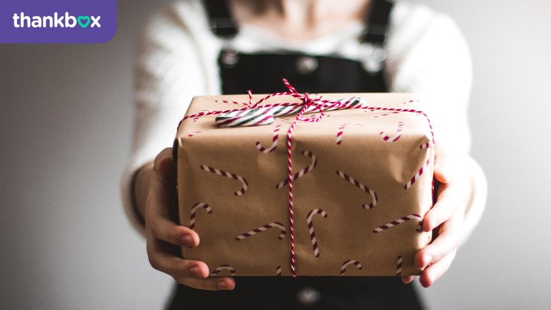 Giving a gift wrapped in brown paper