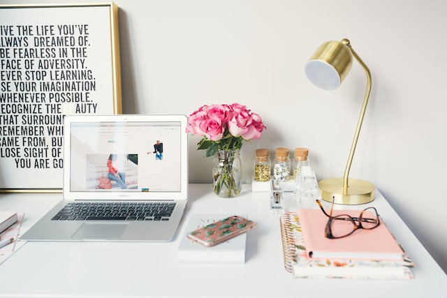 A desk with Macbook