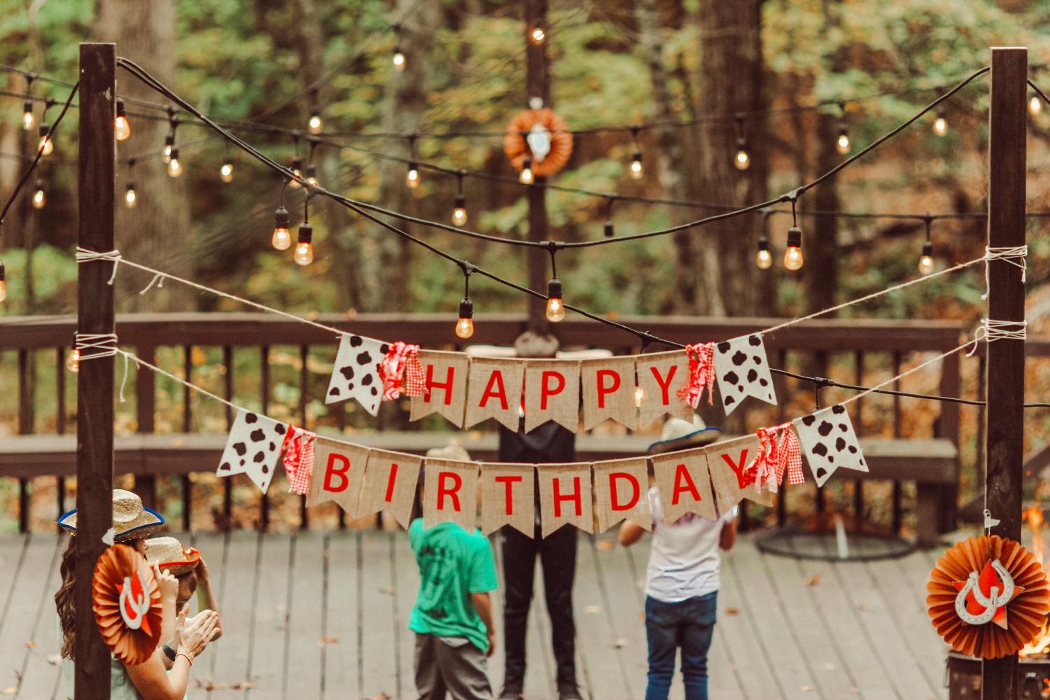 Happy birthday sign made from fabric hanging outdoors