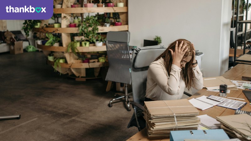 Stressed woman working alone in the office