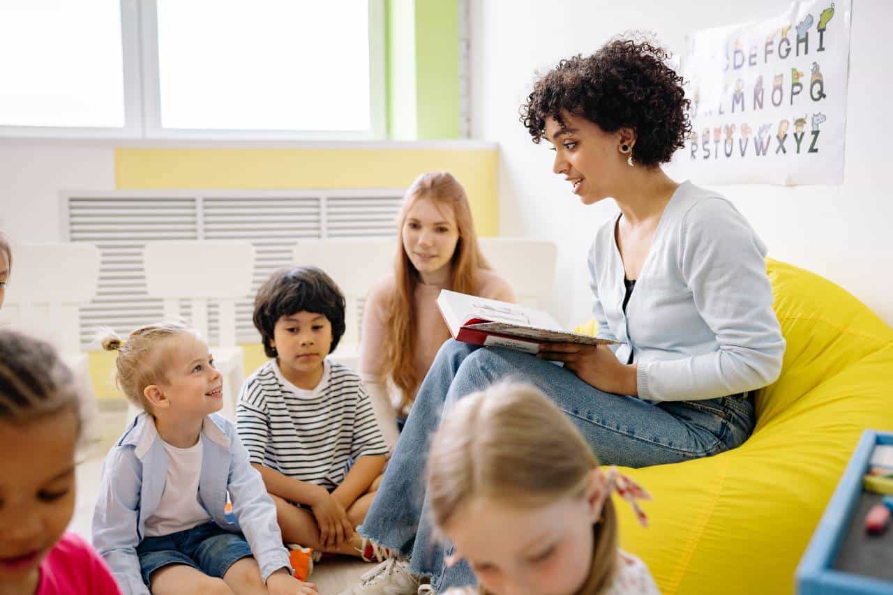 A teacher reading to a primary school class 