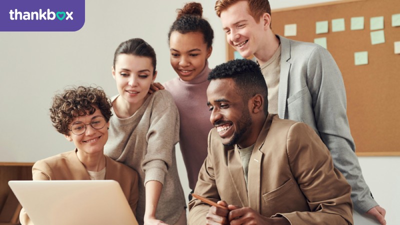 Colleagues looking at a laptop screen