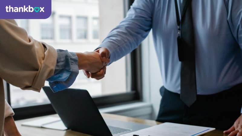 Employer and employee shaking hands