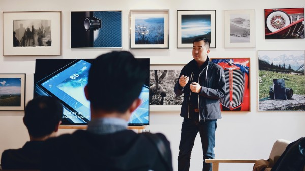 Asian man doing a presentation