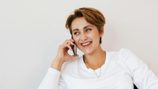 Happy woman speaking on the phone