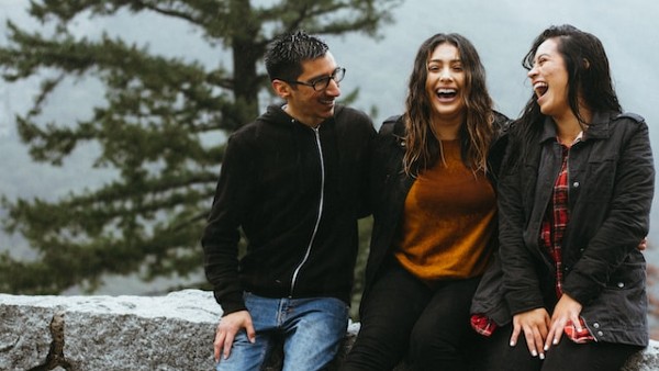 three friends laughing together