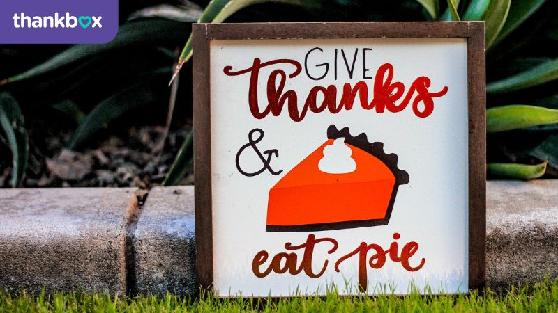 A 'give thanks' and eat pie sign.