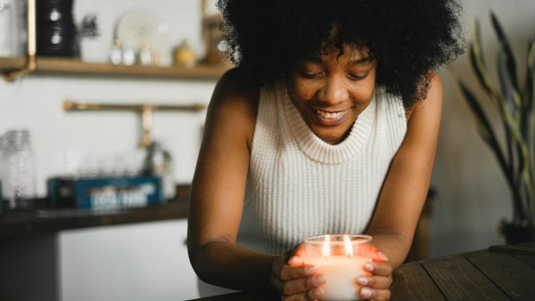 Woman holding a scented candle