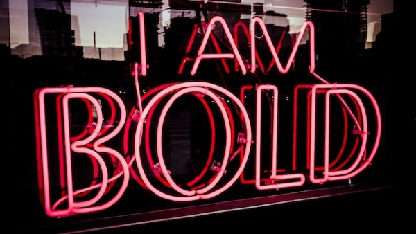 I Am bold neon signage at night time

