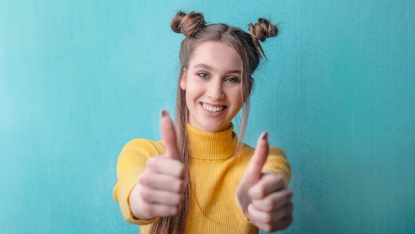 Woman in Yellow Turtleneck Sweater Smiling
