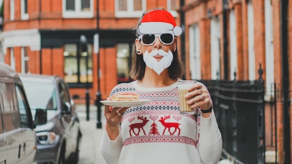 Woman as santa with coffee and pastry