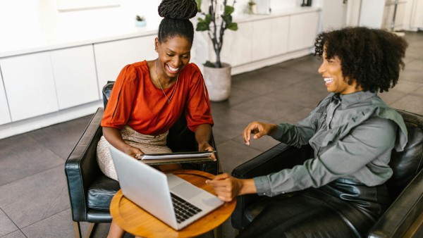 Businesswomen sitting on chairs