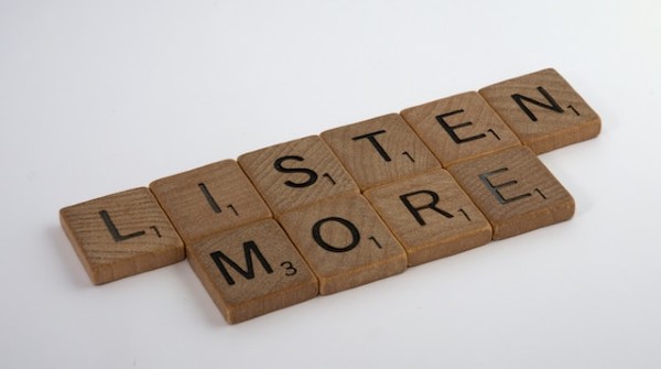 Listen more in wooden letters