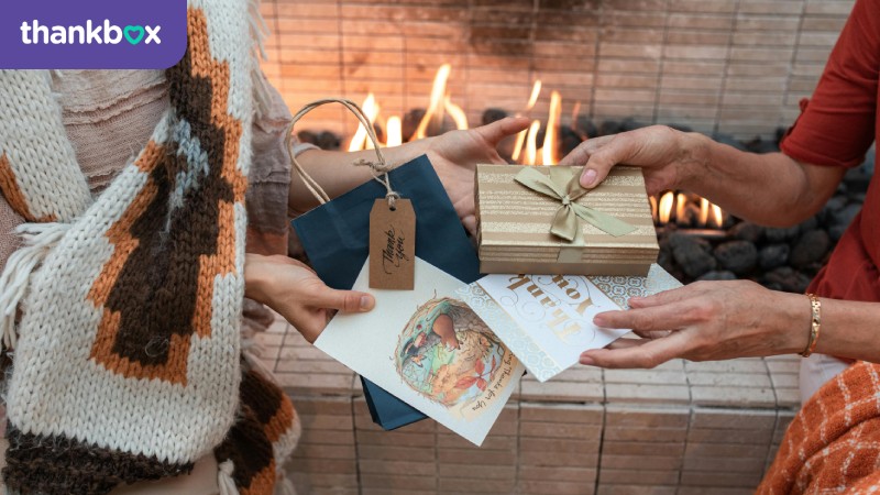 Close-up Shot of People Exchanging Gifts and Cards