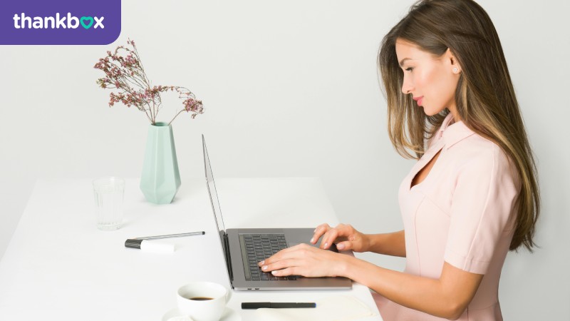 Woman typing on a laptop