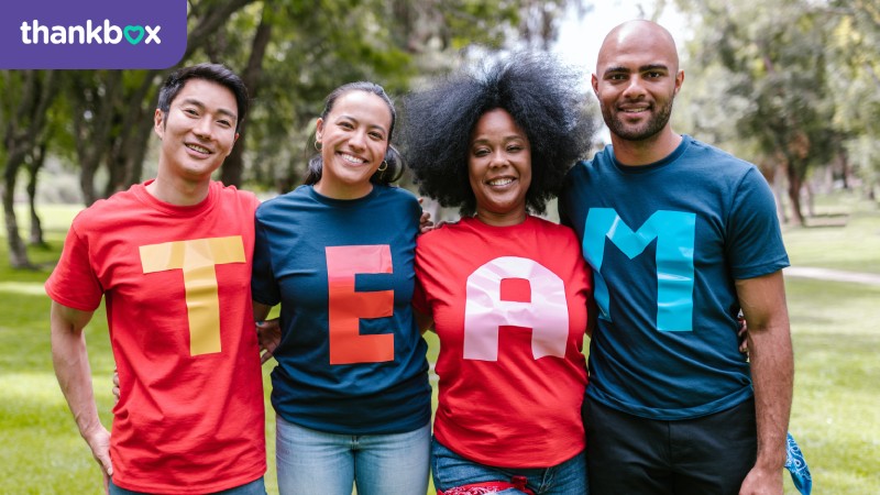 Group of people wearing T-shirts that spell Team