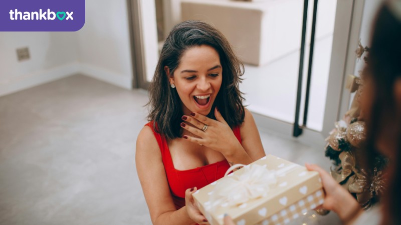 Surprised woman receiving a gift