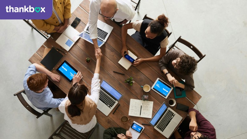 People doing handshakes in a meeting