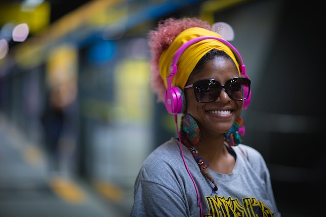 A woman with headphones - customised playlist