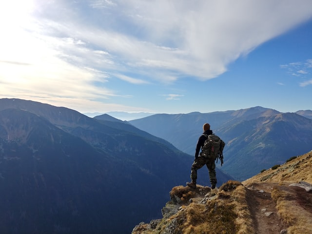 An image of a person on a mountain summit