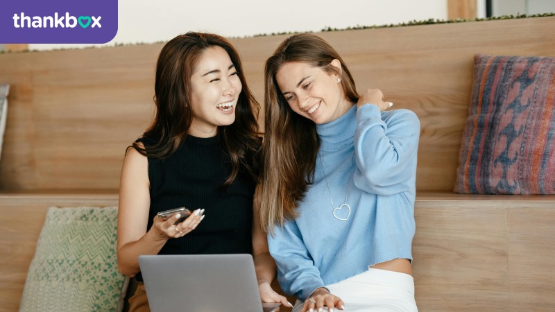 Young positive multiethnic women working together