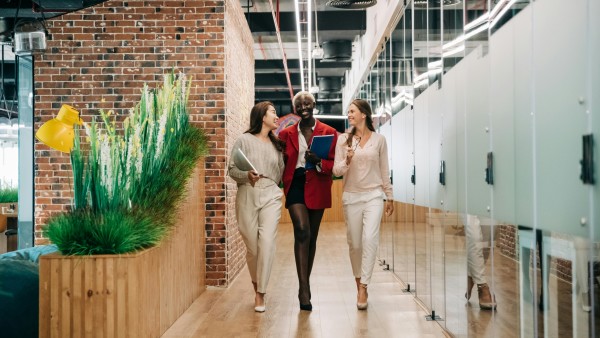 Multiethnic businesswomen walking in a contemporary office