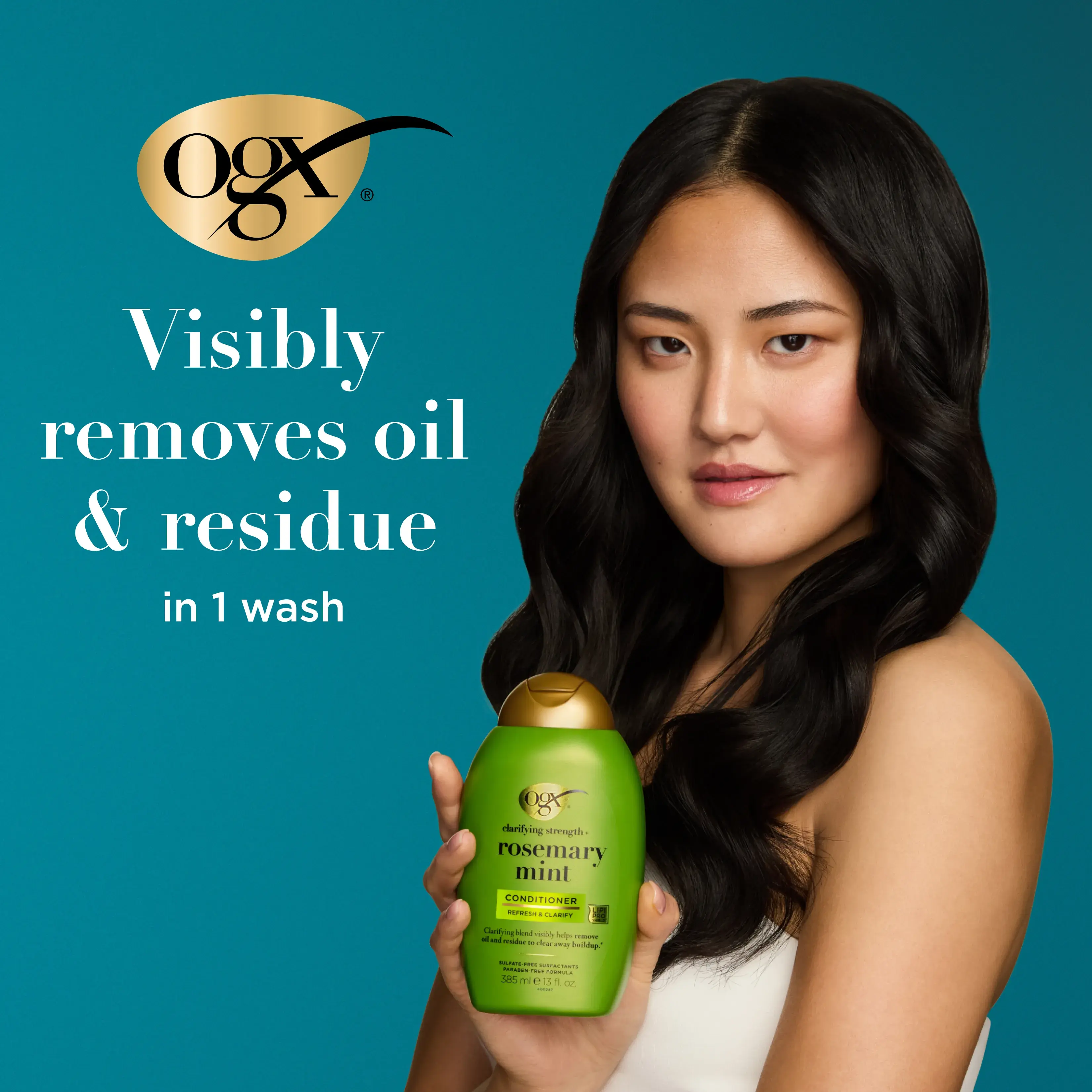 Woman holding Rosemary Mint Conditioner. Visibly removes oil & residue in 1 wash