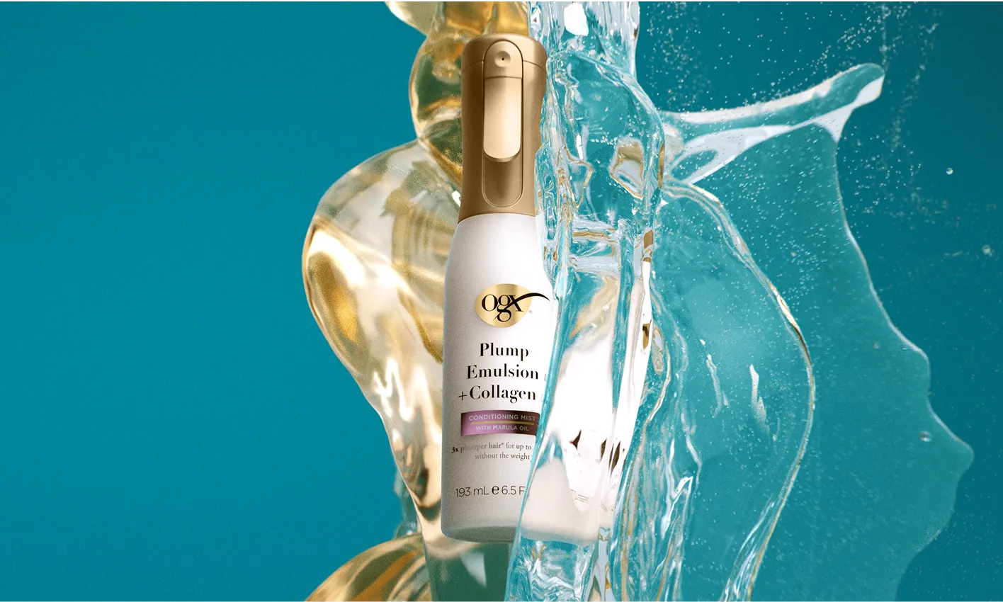 Bottle of Smooth Emulsion + Collagen Conditioning Mist being splashed and covered in oil
