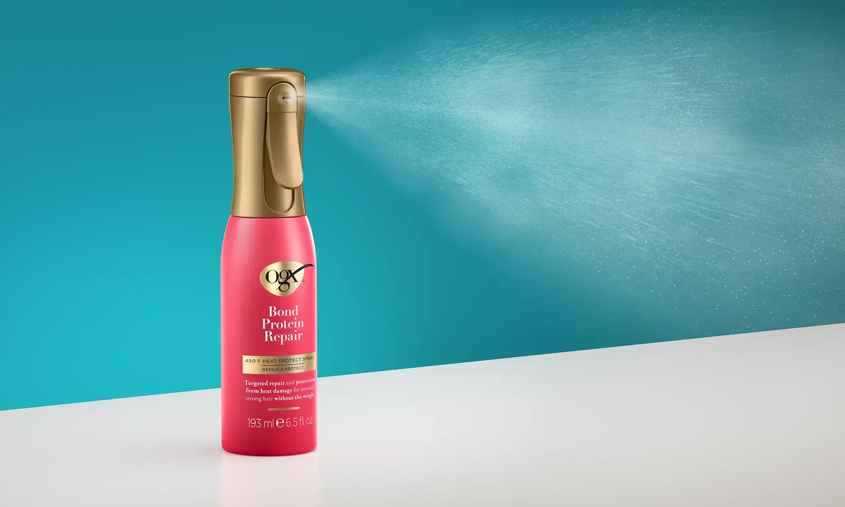 Image displaying OGX® Bond Protein Repair 450°F Heat Protect Spray in use