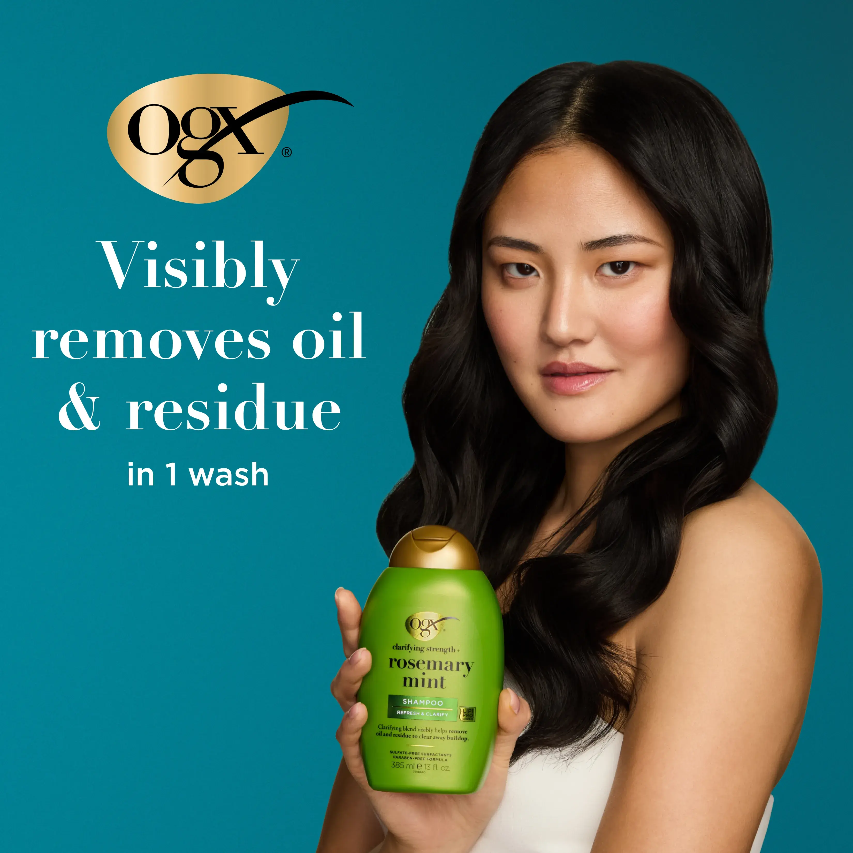 Woman holding Rosemary Mint Shampoo. Visibly removes oil & residue in 1 wash