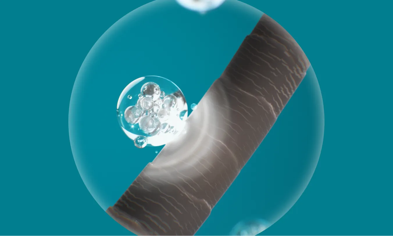 Closeup Image of Peptides being applied to hair follicle roots