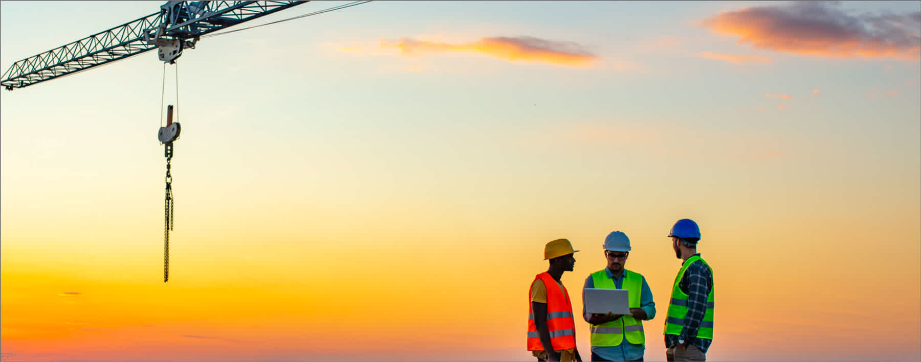 Construction Workers Under a Crane